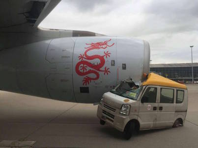 WATCH: Van crushed after driving straight into Dragonair plane's engine at Hong Kong airport: Shanghaiist