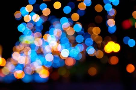 Stock image of 'Christmas shiny city bokeh in yellow and blue colors'